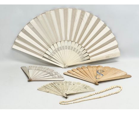 Early 20th Century bone fans and a large bone necklace. Including a vintage wooden fan.
