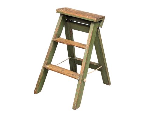 A small Early 20th Century pine step ladder with original paint.