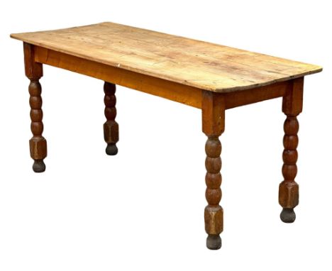 A 19th Century Victorian pine farmhouse kitchen table with bobbin turn legs. 162x65x75cm
