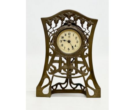 An Early 20th Century Art Nouveau brass framed mantle clock. Junghans. 14x4x19cm