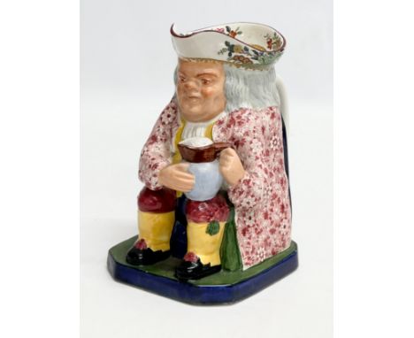 A 19th Century English pottery toby jug. Probably Copeland Spode. 16x11x19cm.