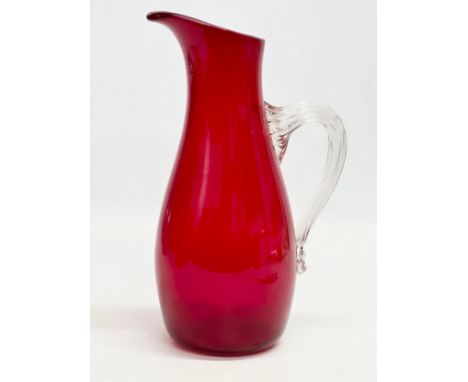 A large ruby glass jug designed by Geoffrey Baxter for Whitefriars. 25.5cm