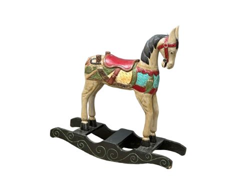 A vintage wooden rocking horse. 100x35x103cm