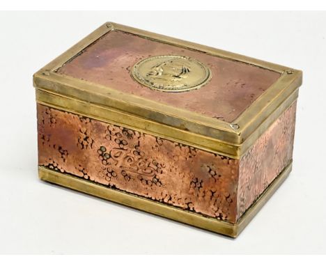 A Late 19th Century Victorian copper and brass bound tea caddy. 16x11x8.5cm.
