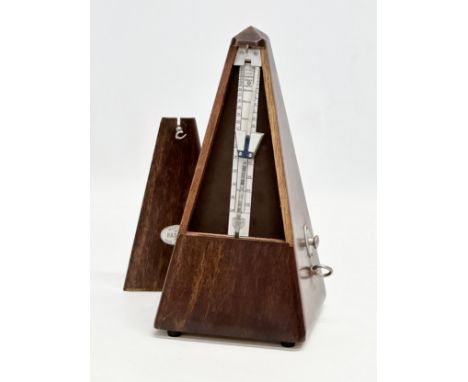 A French Maelzel Paquet metronome. 23cm.