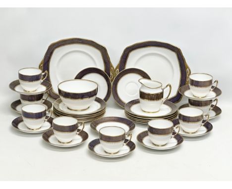 Royal Albert. A 1920’s 36 piece Royal Albert gilt and cobalt blue crown china tea service.