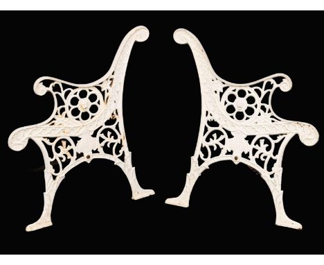 A pair of cast iron garden bench ends.