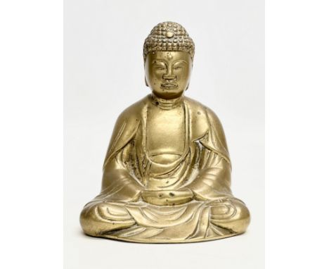 An Early/Mid 20th Century brass Shakyamuni Buddha statue. 12x10x15.5cm.