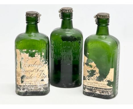 Three 1920’s Gordon’s Special Dry London Gin bottles. 19cm