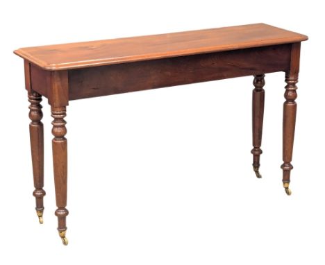 A Victorian mahogany console table on brass cup casters. 123x35x73cm