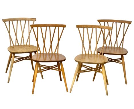 A set of 4 Ercol Mid Century elm and beech “Candlestick” chairs. Model 376.