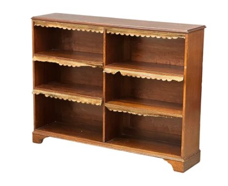 A large Victorian mahogany open bookcase on bracket feet. 141x33x108cm