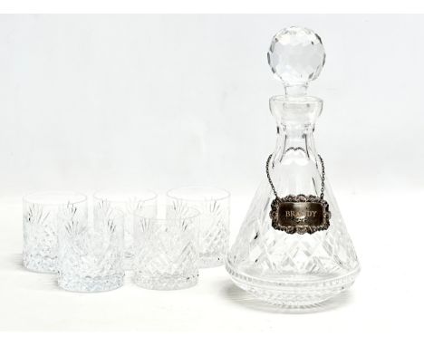 Silver label. A Tyrone Crystal decanter with 5 Tyrone “Slieve Donard” whiskey glasses.