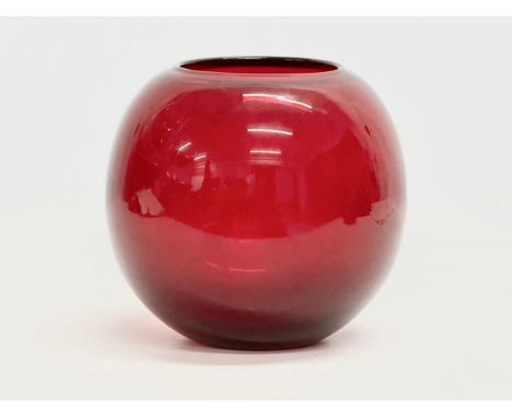 A Mid 20th Century ruby glass bulbous vase. In the manner of Geoffrey Baxter for Whitefriars. 19x19cm.