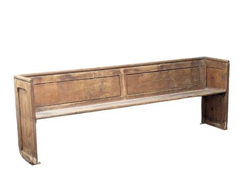 A large late 19th Century pine bench / Church pew. 242cm