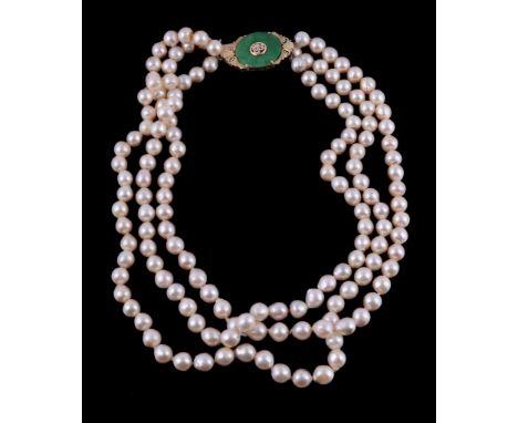  A three strand cultured pearl necklace,   the graduated strands composed of cultured pearls on a knotted string, to the clas