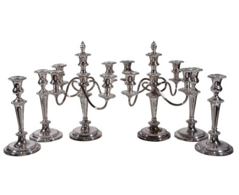  A pair of electro-plated four light candelabra and four candlesticks,   stamped  Garrard  &  Co. Ltd., Regent St. London W.1