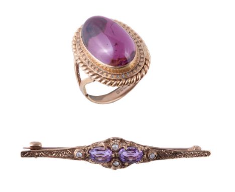  A 9 carat gold pink tourmaline ring,   the oval cabochon pink tourmaline in a collet setting, stamped 375 with full Birmingh