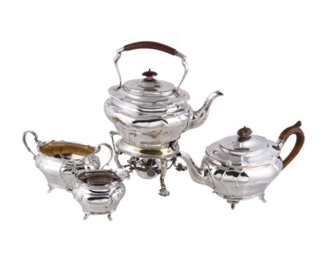  An Edwardian silver three piece oval baluster tea service by Goldsmiths  &  Silversmiths Co. Ltd.,   London 1904 and 1905, t