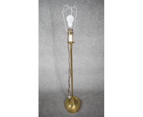 A vintage solid brass weighted base height adjustable standard lamp with silk wrapped cord. H.124 W.26 