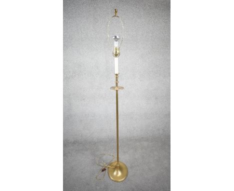 A vintage solid brass candle design height adjustable standard lamp with ridged circular base. H.160 