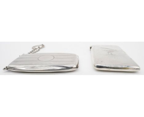Two silver visitors card cases. One with diagonal hinged lid with engraved crest of arms. Hallmarked: H&amp;C for Hamilton &a