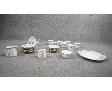 A Royal Crown Derby Brittany pattern part tea set. Including 8 saucers, 8 cake plates, 1 serving plate, 6 tea cups and a coff