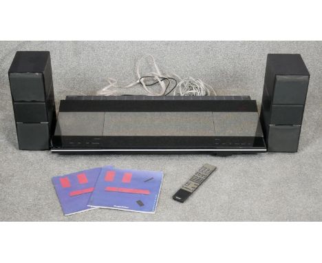 A 1980's Bang and Olufsen Beocenter 9500: radio, CD and tape deck with two Beovox 75 speakers accompanied by cables, instruct