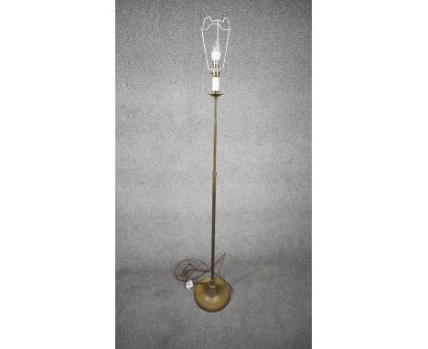 A vintage solid brass weighted base height adjustable standard lamp with silk wrapped cord. H.151 