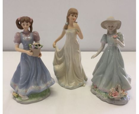 3 ceramic figurines. 2 by Regal: Poppy and Zoe. Together with one other.