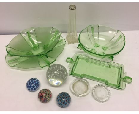 A quantity of glass items to include Art Deco green glass bowls, paperweights and silver rimmed bud vase.