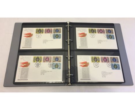 A large blue album containing a collection of first day covers dating from the 1970s.