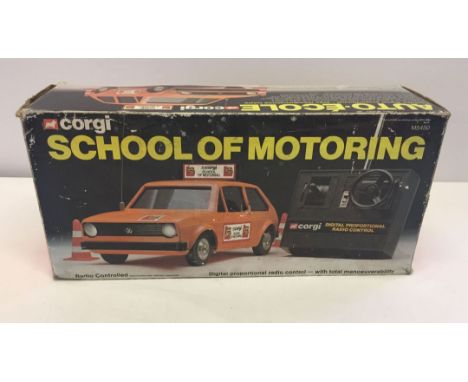 A boxed Corgi radio controlled School of Motoring.