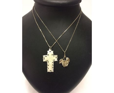 2 pendants on silver chains - one is a cross carved from mother of pearl, measures 4.5cm long.  The other is a rose measuring