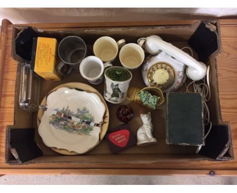 A box of mixed ceramic items to include: a Belleek cat, Holkham jam pot and a Royal Winton telephone.