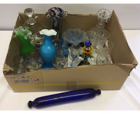 A box of mixed glassware to include a blue glass rolling pin.