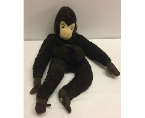 A Merrythought monkey pyjama case with zip back.