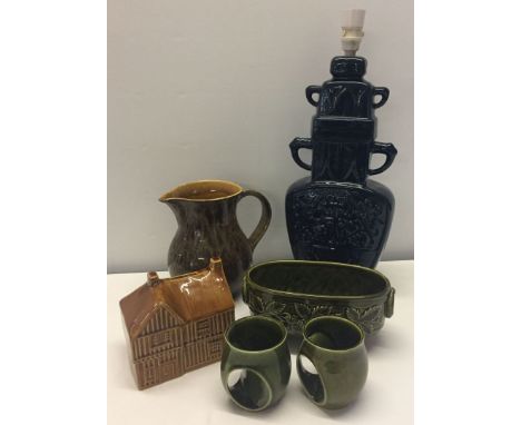 A small collection of Holkham Pottery to include lamp base (small chip to base), money box & jug.