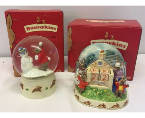 A ceramic Bunnykins figurine 'Forever and a Day' together with 'Footprints in the Snow' snowglobe - both items boxed.