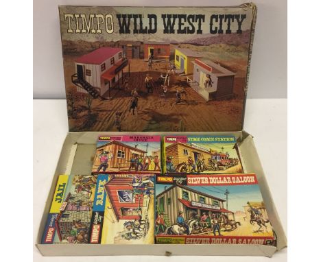 A Timpo Wild West City set comprising Marshal's Office, Stage Coach Station, Jail, Bank, Silver Dollar Saloon, and play board