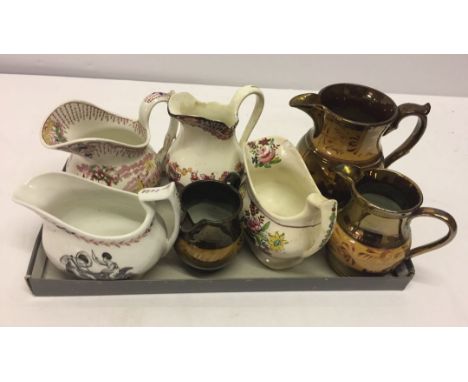 A small collection of ceramic jugs to include 3 copper lustre jugs.