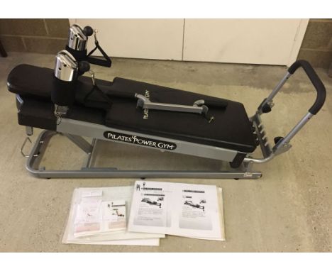 A Pilates Power Gym machine as new complete with paperwork and manual.