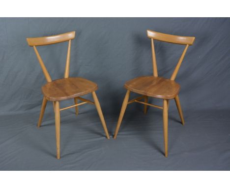 A PAIR OF ERCOL ELM AND BEECH STACKING CHAIRS, with single top rail on tapering supports, approximate height 75.5cm
