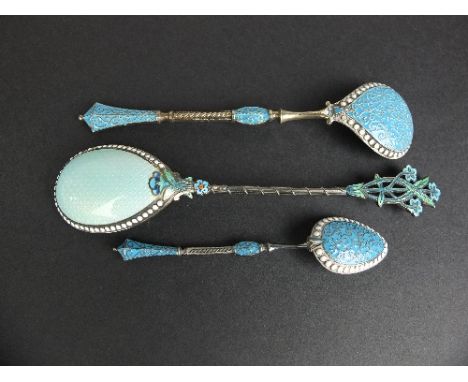 A NORWEGIAN WHITE METAL AND TURQUOISE ENAMEL TEASPOON, stamped Norway, together with a similar preserve spoon and another wit