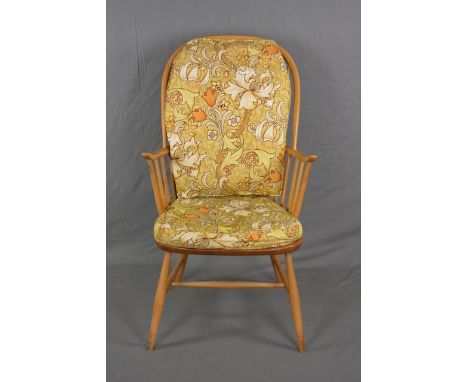 AN ERCOL ELM AND BEECH SPINDLE BACK WINDSOR ARMCHAIR, with original floral cushions to seat and back