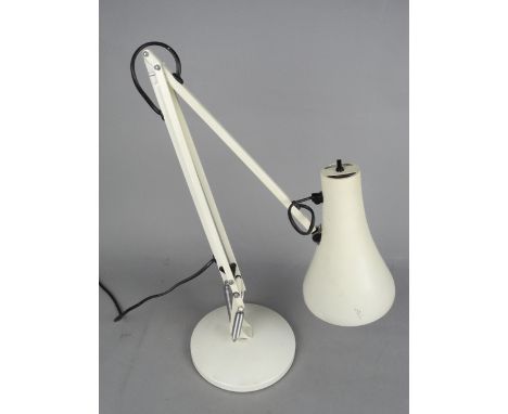 A CREAM ANGLE POISE STYLE DESK LAMP, on a circular base