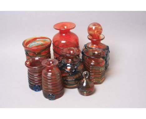 A GROUP OF ORANGE MDINA GLASS VASES, all with an applied blue ribbon trail and a small orange swirl pattern paperweight (8)co