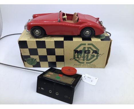 Victory: A boxed Victory Industries, Surrey, remote control, battery operated, MGA, red with tan interior, some warping to ve