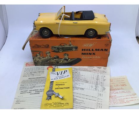 Victory: A boxed Victory Industries, Surrey, battery operated, 1:18 Scale, Hillman Minx Convertible, yellow body with black i