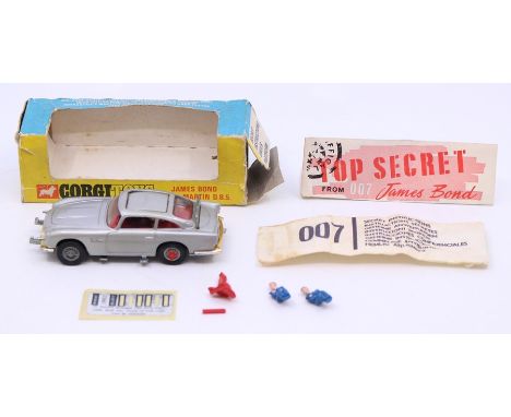 Corgi: A boxed Corgi Toys, James Bond Aston Martin D.B.5, 270, with opened secret instructions and two bandits. Condition Rep